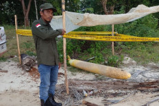 Pongli, a village official in Kangayan, Kangean Island, Sumenep Regency, East Java, shows a missile-like object on Monday found along the village&rsquo;s coastline. 