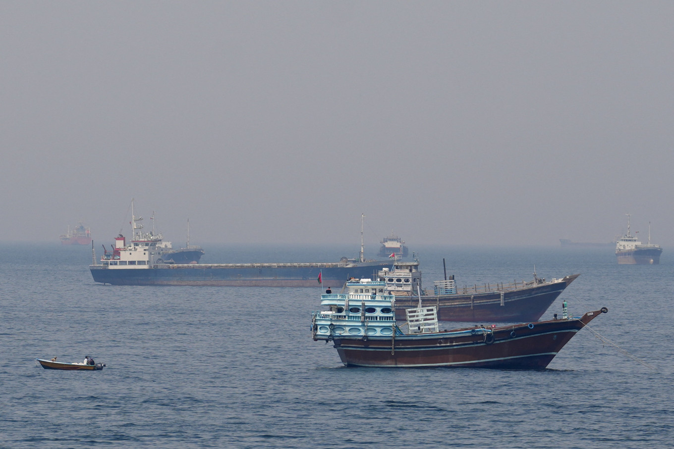 Blockade vs. blockade: Ships and boats sit on the water on Monday, April 20, 2026, in the Strait of Hormuz off the coast of Musandam, Oman. 