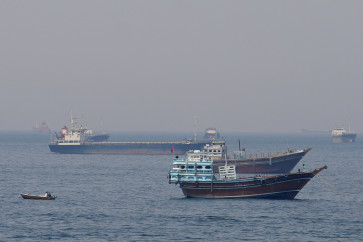 Blockade vs. blockade: Ships and boats sit on the water on Monday, April 20, 2026, in the Strait of Hormuz off the coast of Musandam, Oman. 