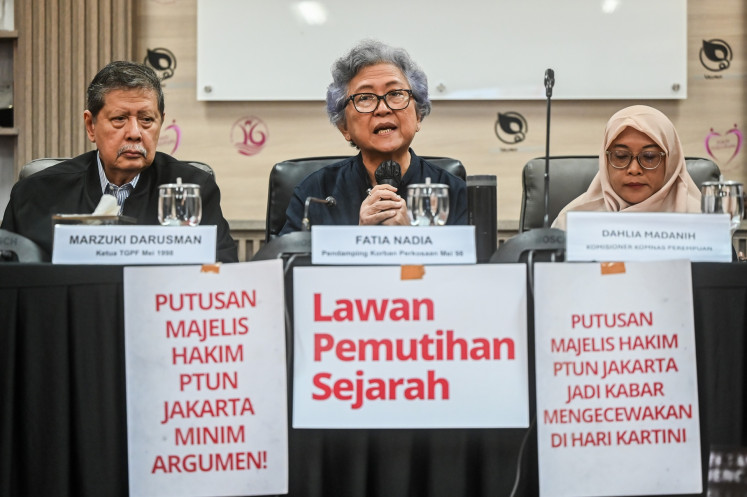 (From left to right) Former attorney general Marzuki Darusman, activist Ita Fatia Nadia and National Commission on Violence Against Women (Komnas Perempuan) commissioner Dahlia Madanih talks to journalist during a press briefing at the commission's office in Jakarta on April 22, 2026.