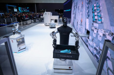 A so-called HMND 01 Alpha robot carries out transport tasks autonomously at the booth of German industrial conglomerate Siemens during a tour of the Hannover industrial trade fair for mechanical and electrical engineering and digital industries, in Hannover, northern Germany on April 20, 2026. 