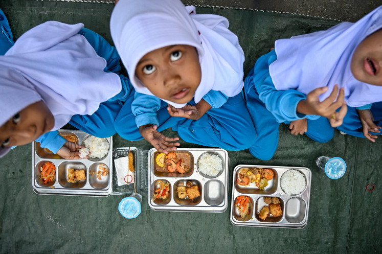 Nourishing program: Kindergarten students eat meals on April 23 supplied by the government&rsquo;s free nutritious meal program in Banda Aceh, Aceh.