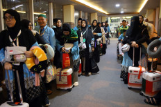 First batch pilgrims: Prospective pilgrims from the first flight group of the Medan embarkation line up on April 22 to board an aircraft at Kualanamu International Airport in Deli Serdang, North Sumatra. A total of 360 people originating from Binjai and Medan, departed to Medina, Saudi Arabia.