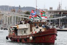 A boat makes a symbolic departure from Barcelona&rsquo;s Port Vell in Spain on April 12, 2026, as the departure of a new humanitarian flotilla bound for the Gaza Strip was postponed due to bad weather.