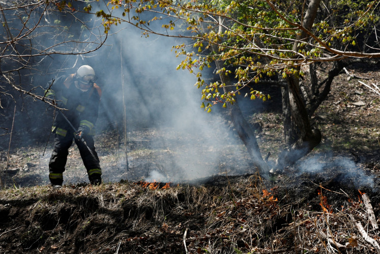 A firefighter works as wildfires continue in Otsuchi, Iwate Prefecture, Japan, on April 26, 2026.