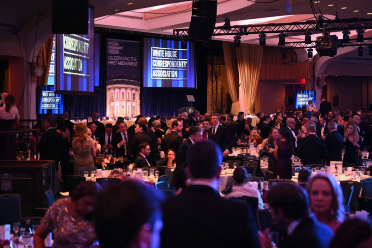 Attendees are seen inside the ballroom after shots were reportedly fired during the White House Correspondents' dinner at the Washington Hilton in Washington, DC, on April 25, 2026. Shots were allegedly fired as United States President Donald Trump attended a press dinner in Washington on Saturday night, witnesses and AFP reporters said as loud bangs were heard at the hotel venue.