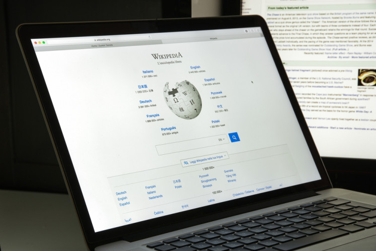 A laptop displays the homepage of the Wikipedia website in this undated illustration. 