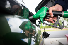 A man fills in his car at a gas station in Saint-Etienne-de-Montluc, western France, on April 15, 2026, as the US-Israel war on Iran, launched on Feb. 28, has roiled global energy and equities markets, sending oil prices skyrocketing after Tehran virtually closed the key Strait of Hormuz.
