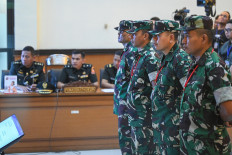(From left to right) Defendants Second Sgt. Edi Sudarko, First Lt. Budhi Hariyanto Cahyono, Capt. Nandala Dwi Prasetya and First Lt. Sami Lakka attend their indictment  hearing on April 29 in the case of acid attack against activist Andrie Yunus at the Jakarta Military Court in East Jakarta. Military prosecutors indict them of committing premeditated serious assault by hurling acid at Andrie on March 12 in Jakarta.