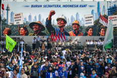 President Prabowo Subianto gestures while delivering a speech in front of thousands of workers during the Labour Day rally celebrations at the National Monument (Monas) in Jakarta on May 1, 2026.