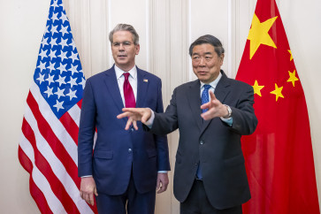 This handout photograph released by the Federal Department of Foreign Affairs or Swiss Foreign Ministry (FDFA) on May 14, 2025, shows China's Vice Premier He Lifeng (right) gesturing next to US Treasury Secretary Scott Bessent prior to a meeting to discuss trade relations and tariffs, in Geneva, on May 10, 2025.