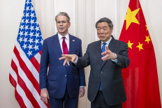 This handout photograph released by the Federal Department of Foreign Affairs or Swiss Foreign Ministry (FDFA) on May 14, 2025, shows China's Vice Premier He Lifeng (right) gesturing next to US Treasury Secretary Scott Bessent prior to a meeting to discuss trade relations and tariffs, in Geneva, on May 10, 2025.