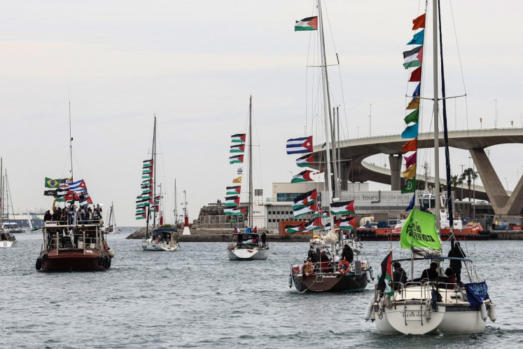Boats of a new humanitarian flotilla bound for the Gaza Strip make a symbolic leave from Barcelona's Port Vell on April 12, 2026.