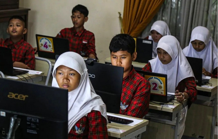 Tech-based test: Students stay focused on their mathematics exams during the inaugural National Academic Competency Test (TKA) at Kalicari 3 state elementary school in Semarang, Central Java, on April 22, 2026. The computer-based assessment is part of a standardized national program conducted simultaneously across the country. 