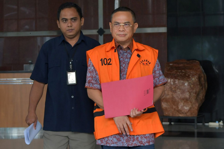 Endemic symptom: Pati Regent Sudewo (right), a Gerindra Party politician, is escorted on April 16, 2026 following his interrogation at the Corruption Eradication Commission (KPK) headquarters in Setiabudi, South Jakarta, in relation to extortion allegations involving village officials.