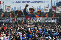 Labor and politics: President Prabowo Subianto (at podium) gestures on Friday, May 1, 2026,  while delivering a speech in front of thousands of workers during Labor Day celebrations at the National Monument (Monas) park in Jakarta.