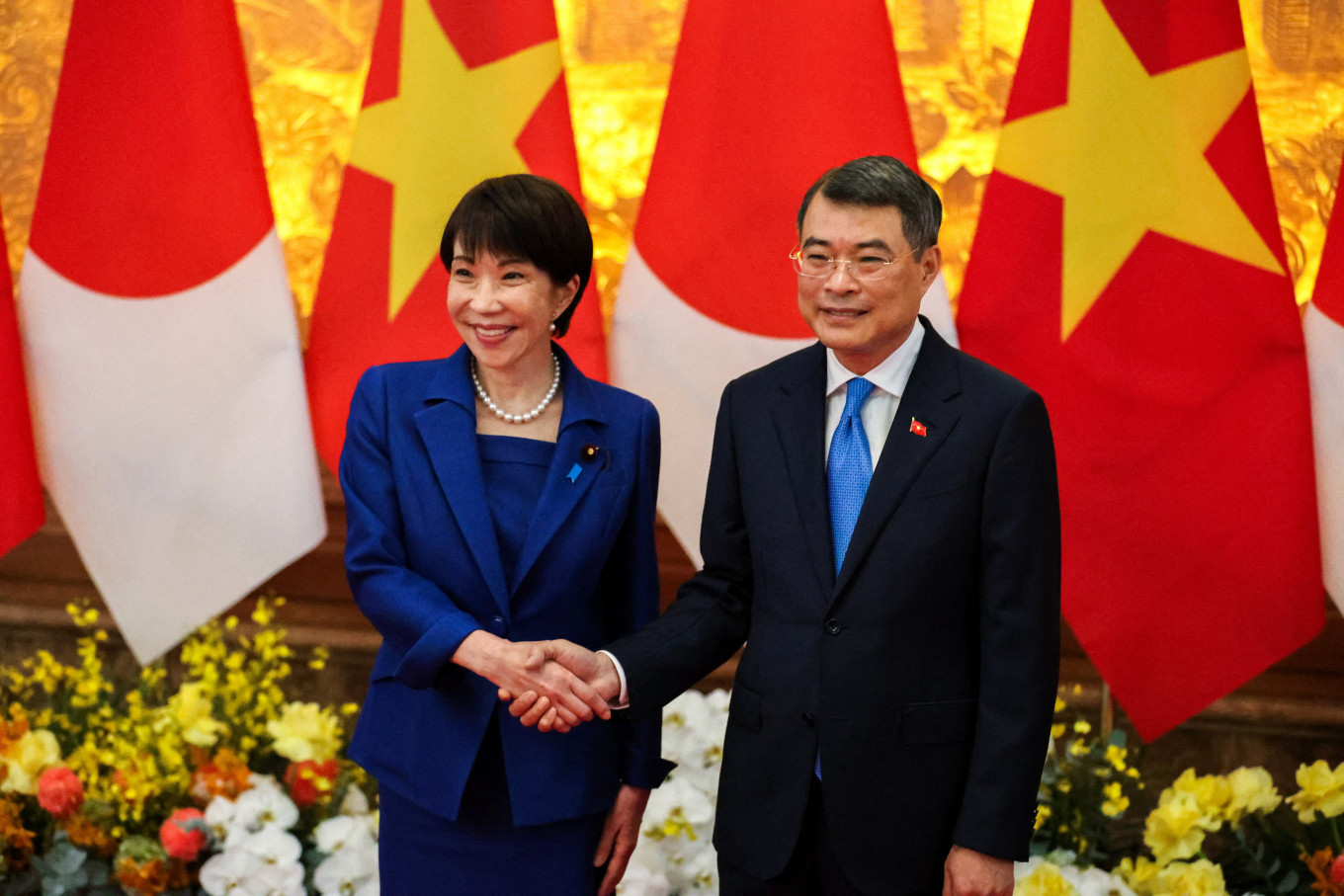 Japan's Prime Minister Sanae Takaichi shakes hands with Vietnam's Prime Minister Le Minh Hung during a welcoming ceremony in Hanoi, Vietnam on May 2, 2026.