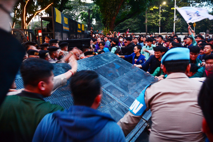 Police attempt to hold back protesters from the Aliansi Badan Eksekutif Mahasiswa Seluruh Indonesia (BEM SI) during a demonstration marking National Education Day on Jl. Medan Merdeka Selatan in Jakarta on May 2, 2026.
The demonstrators expressed their demand for reforms in education budget governance, including separating public education funding from official institutional budgets, ending excessive commercialization of education and ensuring equitable access to quality education. 