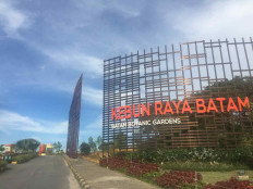 Thin clouds sweep across the skies over the main gate of the Batam Botanical Gardens in Nongsa, Batam city, Riau Islands, in this undated picture.