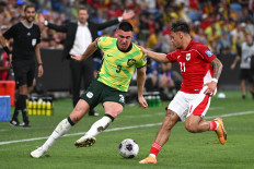 Indonesia's Dean James (right) vies for the ball during a World Cup 2026 Asian qualifier football match between Australia and Indonesia in Sydney, in this file photo taken on March 20, 2025. A Dutch court ruling on May 4, 2026 threatens to throw the Eredivisie into turmoil if NAC Breda succeed in their bid to force a replay of their match against Go Ahead Eagles over the eligibility of defender Dean James.