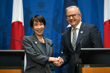 Australia's Prime Minister Anthony Albanese (right) shakes hands with Japan's Prime Minister Sanae Takaichi after speaking to the press at Parliament House in Canberra on May 4, 2026. 