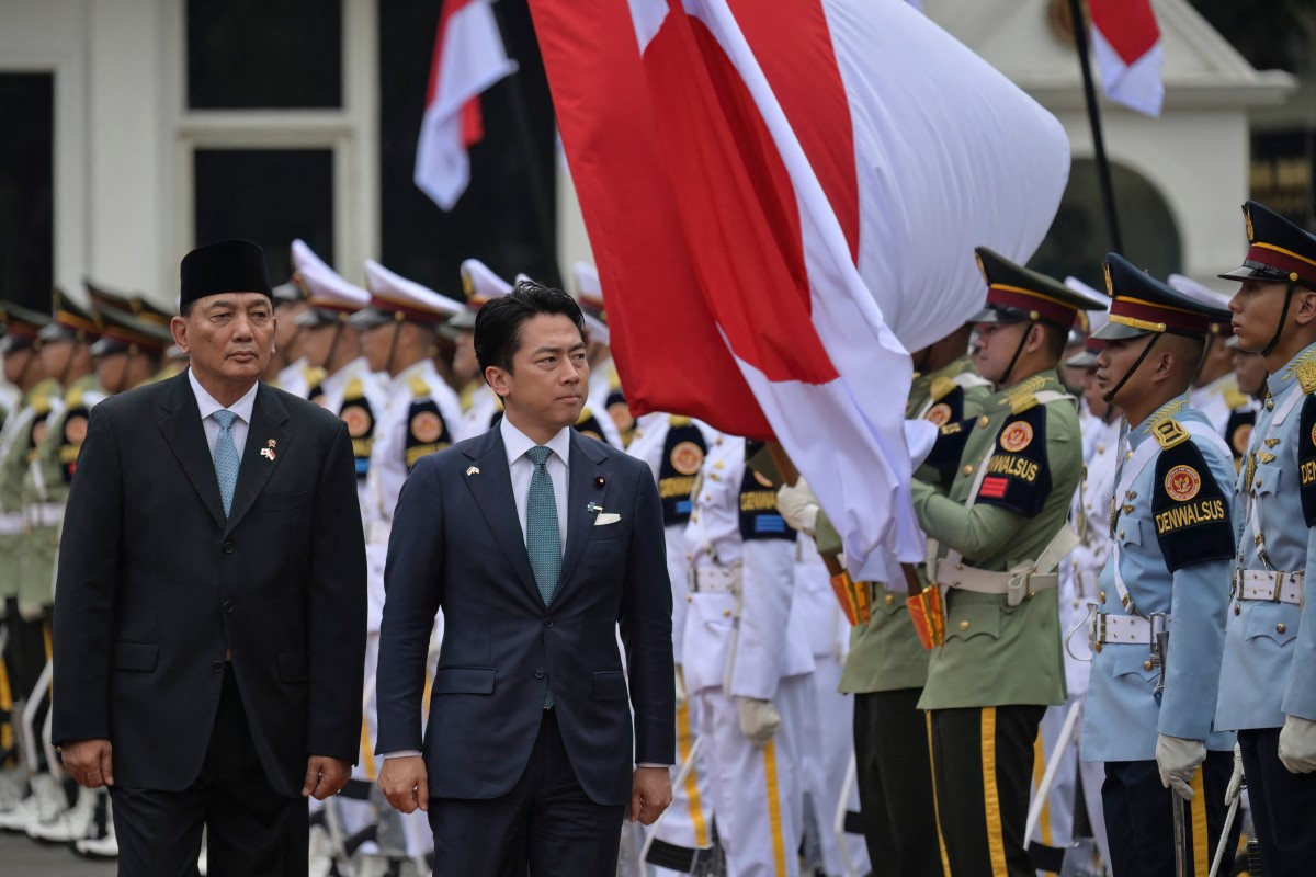 Defence Minister Sjafrie Sjamsoeddin (left) and Japan's Defence Minister Shinjiro Koizumi (right) inspect honour guards during a welcome ceremony at the Defence Ministry office in Jakarta on May 4, 2026. 