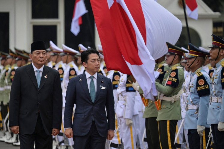 Defence Minister Sjafrie Sjamsoeddin (left) and Japan's Defence Minister Shinjiro Koizumi (right) inspect honour guards during a welcome ceremony at the Defence Ministry office in Jakarta on May 4, 2026. 