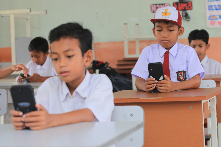 Students take a final exam using their devices on May 4, 2026, at SD 16 state elementary school in Blang Beurandang village, West Aceh, Aceh. A total of 44 out of 156 elementary schools across 12 districts in West Aceh have implemented computer-based testing.