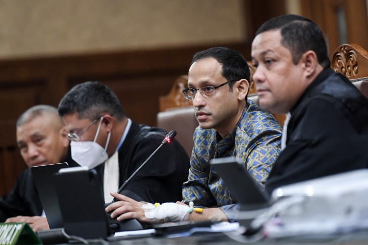 Former education, culture, research and technology minister Nadiem Makarim (second right) attends his trial at the Jakarta Corruption Court on Monday in a corruption case about his involvement in the procurement of Google Chromebook laptops for use at schools.