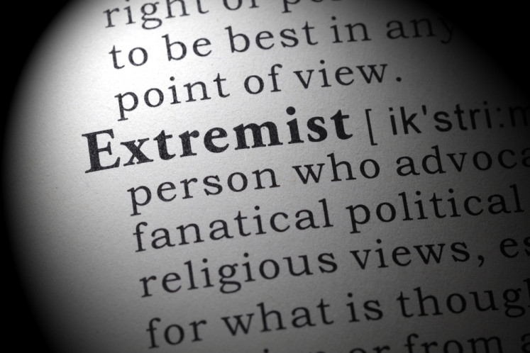 An illustration of the definition of &ldquo;extremist&ldquo; in a dictionary