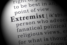 An illustration of the definition of &ldquo;extremist&ldquo; in a dictionary