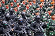 Army personnel march on Oct. 5, 2025, during an event marking the 80th anniversary of the Indonesian Military (TNI) in Banda Aceh, Aceh. (AFP/Chaideer Mahyuddin)