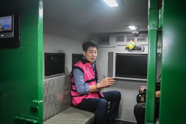 Face the justice: Samin Tan, owner of PT Asmin Koalindo Tuhup, sits inside a detainee vehicle after questioning at the Attorney General&rsquo;s Office (AGO) in Jakarta on March 28, 2026. The AGO has named him a suspect in an alleged corruption case involving irregularities in coal mining management in Murung Raya regency, for continuing mining and selling coal despite his permit being revoked in 2017. 