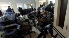 Officers from Batam Immigration Office raid an international scam center syndicate on April 6 operating out of Baloi View Apartment in Batam city, Riau Islands. Officers detained hundreds of foreigners and confiscated hundreds of digital devices used in the scam operations.