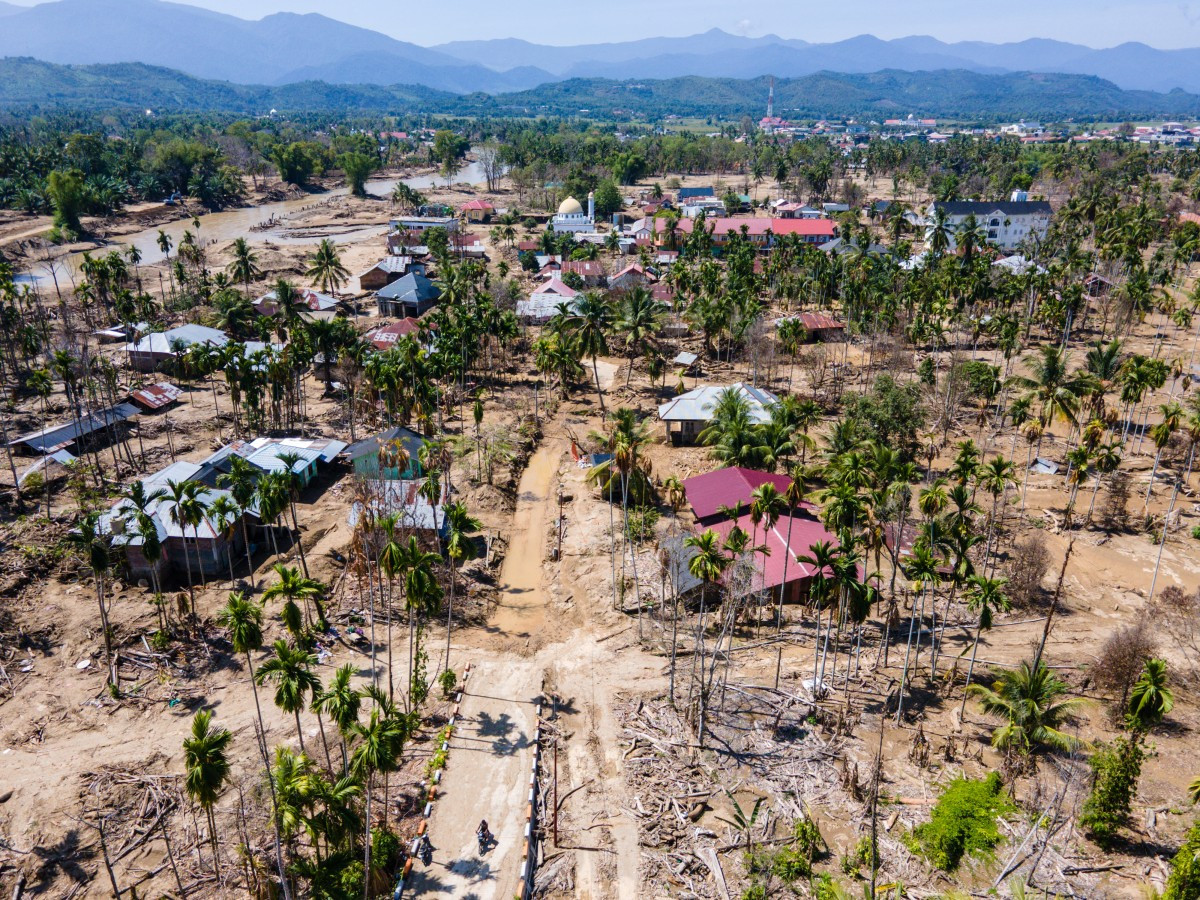 An aerial view shows flood damage to a residential area in Meurah Dua, Pidie Jaya regency, Aceh on Feb. 22, 2026, after devastating cyclone-induced floods and landslides struck northern Sumatra in November 2025. 