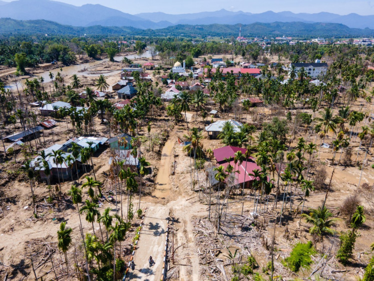 An aerial view shows flood damage to a residential area in Meurah Dua, Pidie Jaya regency, Aceh on Feb. 22, 2026, after devastating cyclone-induced floods and landslides struck northern Sumatra in November 2025. 