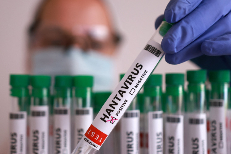 A test tube labelled 'Hantavirus positive' is held in this illustration taken on May 7, 2026. 