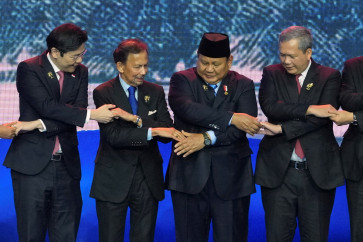 Singapore's Prime Minister Lawrence Wong, Brunei's Sultan Hassanal Bolkiah, Indonesia's President Prabowo Subianto, and Cambodia's Prime Minister Hun Manet (from left to right) hold hands for a group photo during the opening ceremony of the 48th ASEAN Summit and Related Meetings, in Cebu, Philippines, May 8, 2026. 