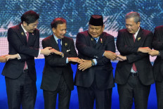 Singapore's Prime Minister Lawrence Wong, Brunei's Sultan Hassanal Bolkiah, Indonesia's President Prabowo Subianto, and Cambodia's Prime Minister Hun Manet (from left to right) hold hands for a group photo during the opening ceremony of the 48th ASEAN Summit and Related Meetings, in Cebu, Philippines, May 8, 2026. 