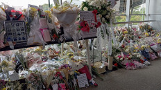 Tributes in Bekasi: Flower bouquets on May 2, 2026, line Bekasi Timur Station in West Java. Commuters placed the flowers in memory of the 16 women killed in the deadly April 27 train collision.