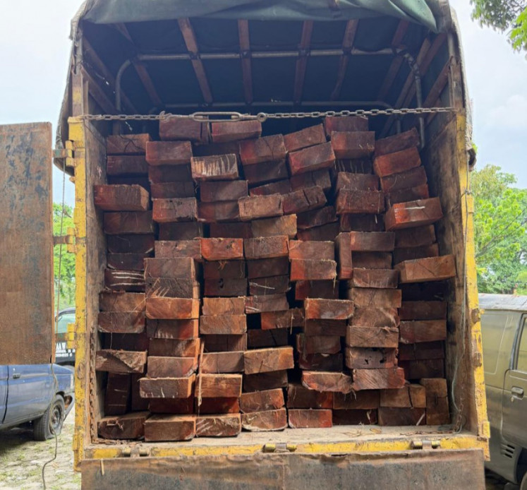 A truck is impounded at the Riau Police headquarters in Pekanbaru in this undated photo released on May 11, 2026. The truck contained some 10 cubic meters of illegally logged timber from the Giam Siak Kecil Biosphere Reserve in Siak regency, Riau.  