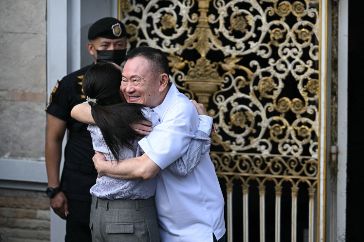 Warm reunion: Thailand&rsquo;s former prime minister Thaksin Shinawatra (right) hugs his daughter Paetongtarn Shinawatra upon his release on Monday, May 11, 2026, at Klong Prem Central Prison in Bangkok. Former PM Thaksin was released early from prison on May 11, raising the prospect of a return to the spotlight for the political heavyweight.