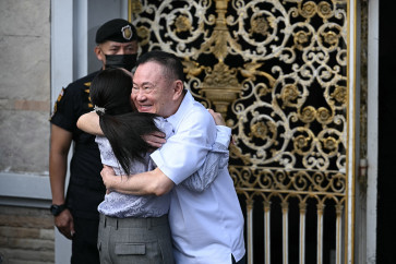 Warm reunion: Thailand&rsquo;s former prime minister Thaksin Shinawatra (right) hugs his daughter Paetongtarn Shinawatra upon his release on Monday, May 11, 2026, at Klong Prem Central Prison in Bangkok. Former PM Thaksin was released early from prison on May 11, raising the prospect of a return to the spotlight for the political heavyweight.