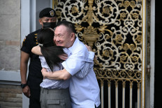 Warm reunion: Thailand&rsquo;s former prime minister Thaksin Shinawatra (right) hugs his daughter Paetongtarn Shinawatra upon his release on Monday, May 11, 2026, at Klong Prem Central Prison in Bangkok. Former PM Thaksin was released early from prison on May 11, raising the prospect of a return to the spotlight for the political heavyweight.