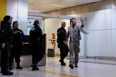 Brazilian activist Thiago Avila, who was detained aboard the Gaza-bound Global Sumud Flotilla, which was intercepted by Israeli forces, gestures as he arrives at Sao Paulo/Guarulhos International Airport after being deported, in Guarulhos, Brazil, May 11, 2026. 