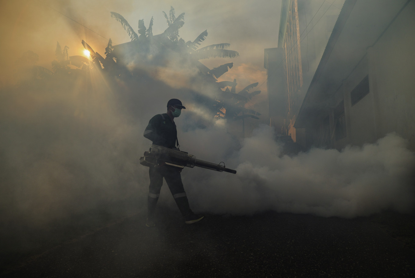 A Ternate Health Agency official sprays insecticide with a fogging machine at the city's haj dormitory in Ternate, North Maluku on April 22, 2026. Officials sprayed insecticide in bedrooms, parks and drains to prevent Aedes aegypti mosquitoes, the main vector of dengue, from flourishing.