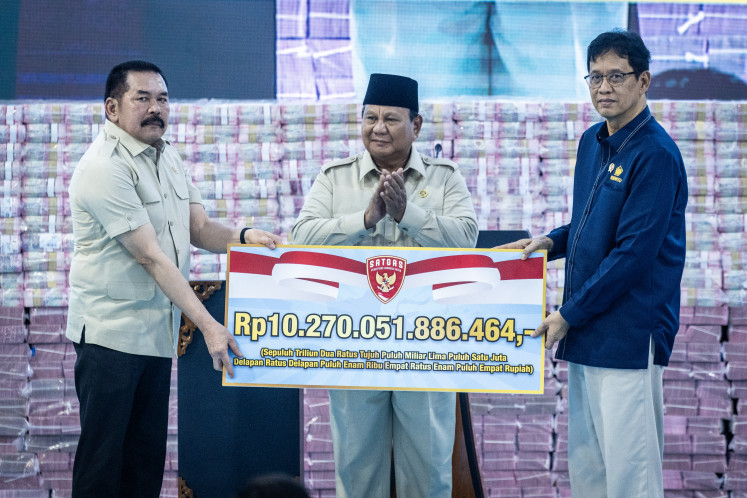 President Prabowo Subianto (center) watches as Attorney General ST Burhanuddin (left) symbolically hands over administrative fine payments on May 13, 2026, to Finance Minister Purbaya Yudhi Sadewa during an event at the Attorney General&rsquo;s Office in Jakarta. The Forest Area Enforcement Task Force handed over 10.27 trillion rupiah to the state treasury, consisting of 3.42 trillion rupiah in forestry administrative fines and 6.84 trillion rupiah in land and non-land tax revenues from task force supervision, as well as 2.37 million hectares of forest land reclaimed by the state.