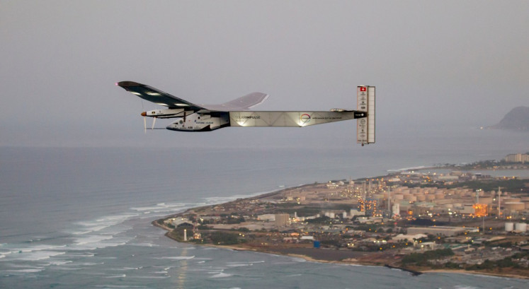 The Solar Impulse 2 solar-powered airplane flies off Kapolei, Hawaii, on March 3, 2016 on an all-day test flight.