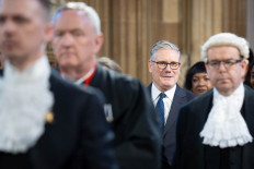 Britain's Prime minister, Keir Starmer walks through the Central Lobby of the Houses of Parliament in London to the House of Lords to hear the King's Speech during the State Opening of Parliament, in London, Britain May 13, 2026.