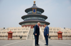 Chinese President Xi Jinping (right) and United States President Donald Trump stand facing each other on May 14, 2026, during a tour of the Temple of Heaven in Beijing.